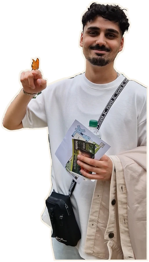 Kerim Ismail with a butterfly on his finger